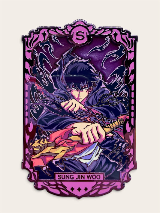 A stylized illustrated character card-style pin featuring Jin-Woo, with a purple ornate border and the name 'SUNG JIN WOO' at the bottom, shown on a light beige background.